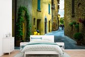 Behang - Fotobehang Straten met traditionele huizen in Toscaanse stad San Gimignano in Italië - Breedte 525 cm x hoogte 350 cm