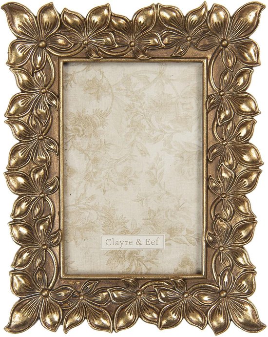 Cadre photo doré (10x15 cm) avec un bord de fleurs détaillées et un fond en tissu à motif floral.