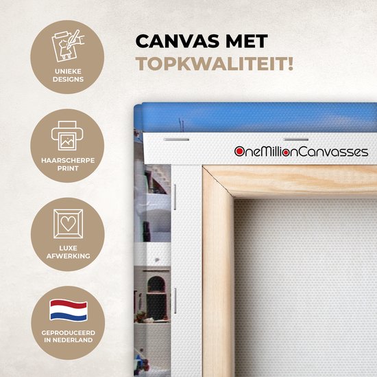 Canvas schilderij 80x40 cm - Wanddecoratie Vlag van Griekenland tussen de witte huisjes - Muurdecoratie woonkamer - Slaapkamer decoratie - Kamer accessoires - Schilderijen op canvas