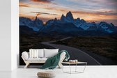 Behang - Fotobehang Zonsondergang achter de bergen in het Nationaal park Patagonia - Breedte 420 cm x hoogte 280 cm