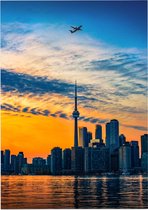 Vliegtuig passeert skyline van Toronto bij zonsongergang - Foto op Forex - 90 x 120 cm