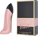 Roze pumpvormige parfumfles naast de verpakking 'Good Girl Carolina Herrera Blush'.
