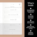 Binnenkant van 'The Five Minute Journal' met secties voor dankbaarheid en dagelijkse affirmaties.