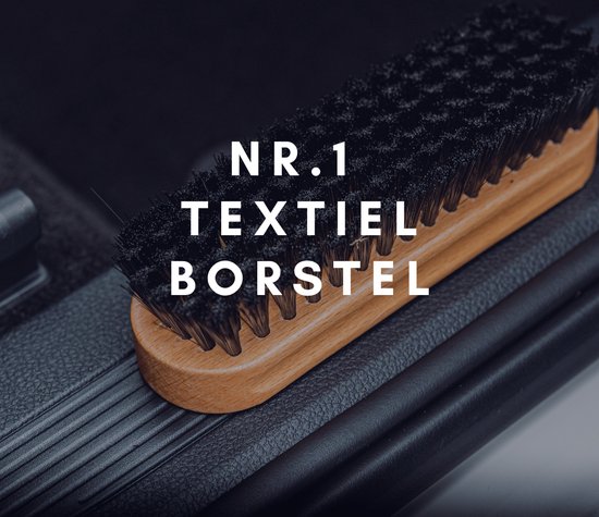 Brosse à poignée en bois et poils de textile noirs, avec le texte "NR. 1 TEXTIEL BORSTEL".