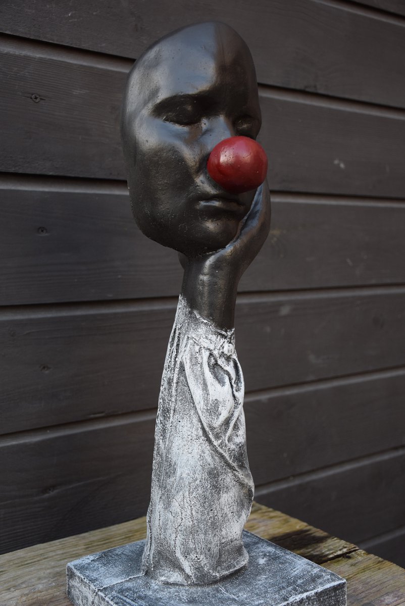 Clownsgezicht op hand