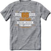 66 Jaar Legend T-Shirt | Goud - Wit | Grappig Verjaardag en Feest Cadeau Shirt | Dames - Heren - Unisex | Tshirt Kleding Kado | - Donker Grijs - Gemaleerd - S