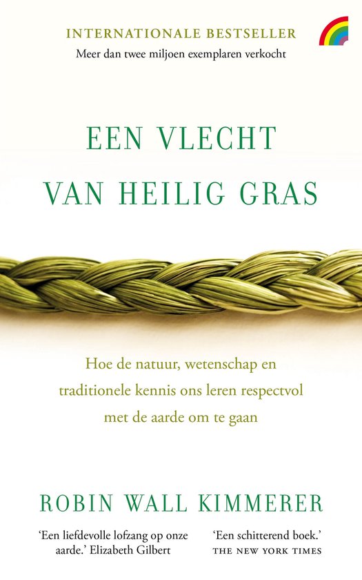 Boekomslag "Een vlecht van heilig gras" met op de voorgrond een gevlochten streng groen gras. Bovenin staat "Internationale Bestseller".