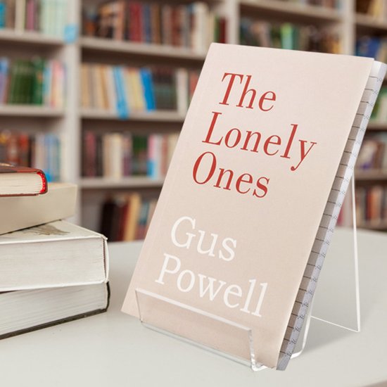 Een boek met de titel "The Lonely Ones" Gus Powell, staand op een transparante standaard.