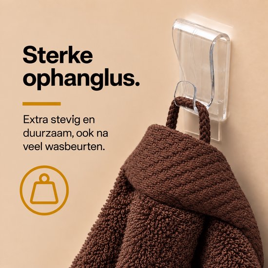 Bruine handdoek hangend aan een sterke, transparante ophanglus voor extra stevigheid na vele wasbeurten.
