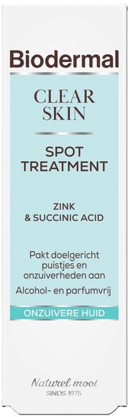 Witte tube Biodermal Clear Skin Spot Treatment met lichtblauwe accenten, bevat zink en barnsteenzuur voor onzuivere huid.