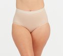 Beige corrigerende slip met hoge taille, naadloos ontwerp met gestructureerde zijpanelen.