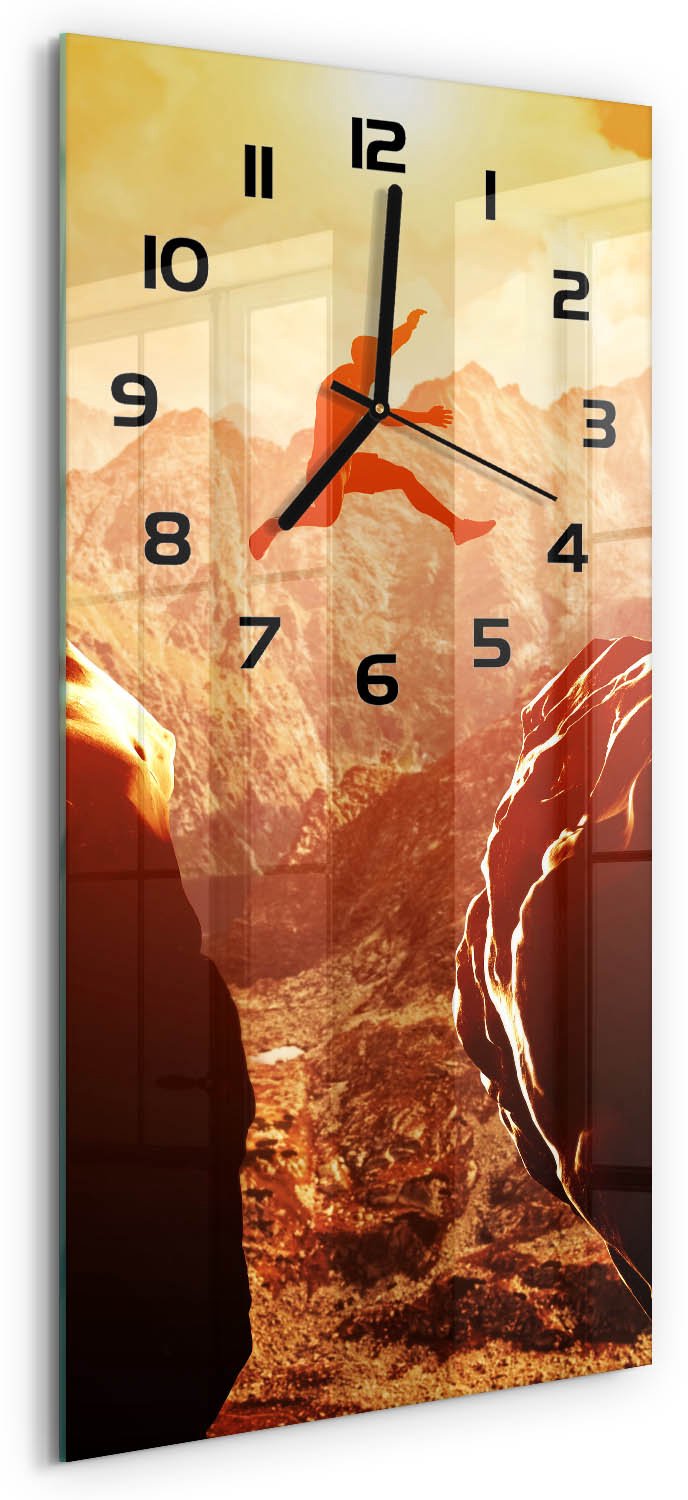 Tulup Wandklok - Spring over de afgrond Gekleurde Glazen Klok - 30x60 cm - Oranje Glazen Klok Met Print - Zwarte handen - Rechthoekige Klok - Moderne Wandklok Glas - Wandklok Glas Decoratie