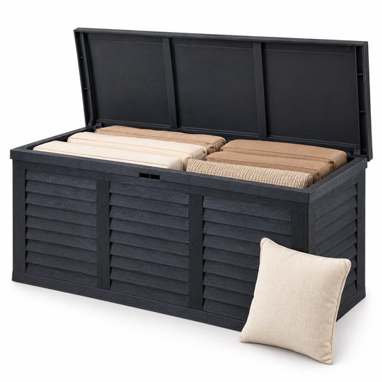 Geopende antraciet kussenbox met kussens erin en een extra kussen ervoor op een witte ondergrond.