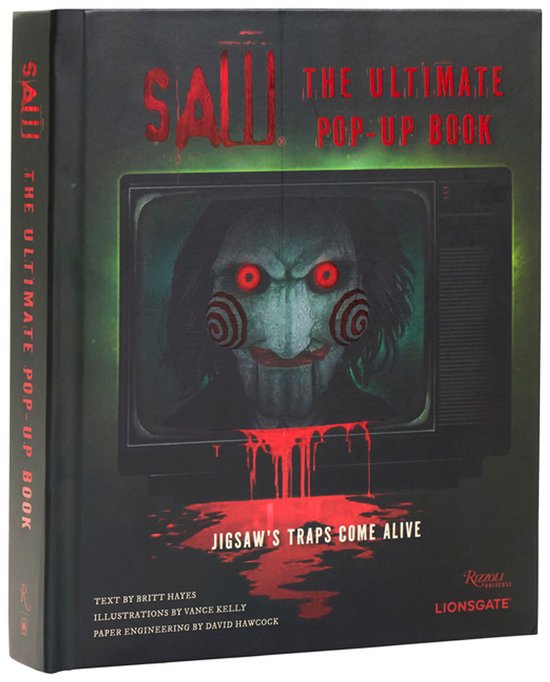 Saw: The Ultimate Pop-Up Book met Billy de pop op een televisie en bloedspatten in groen en rood.