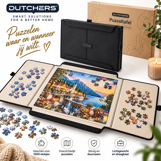 Zwarte Dutchers puzzelkoffer uitgeklapt op tafel met een legpuzzel en losse stukjes op de zijpanelen.
