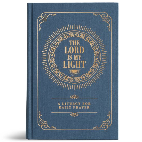 Blauwe hardcover met gouden tekst 'The Lord Is My Light' en sierlijke randversiering.