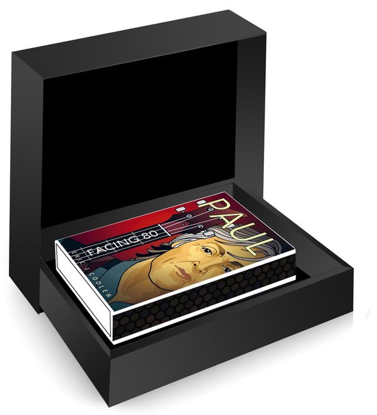 Een klein geïllustreerd boekje met de tekst 'PAUL FACING 80' in een luxe zwarte geschenkdoos.
