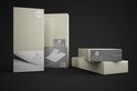 Verpakkingen van creme splittopper hoeslakens met 'Home care' logo.
