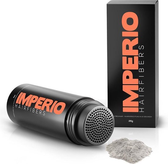 Een fles en doosje IMPERIO Hairfibers in het zwart met oranje tekst, naast een hoopje grijze haarvezels.
