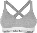 Grijze Calvin Klein bralette met gekruiste bandjes en witte band met logo.