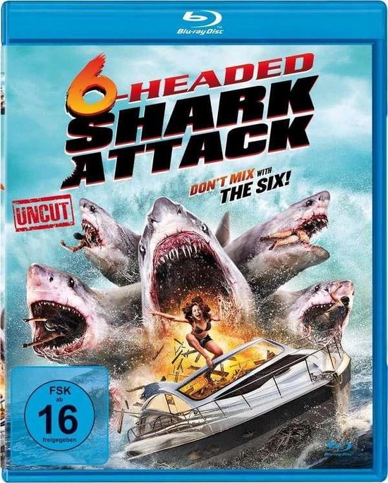 Blu-ray hoes met 6-koppige haaienaanval, met zes haaien die een boot aanvallen. Tekst: '6-Headed Shark Attack', 'Uncut', 'Don't Mix With The Six!'