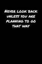 Never Look Back Unless You Are Planning To Go That Way�: A soft cover blank lined journal to jot down ideas, memories, goals, and anything else