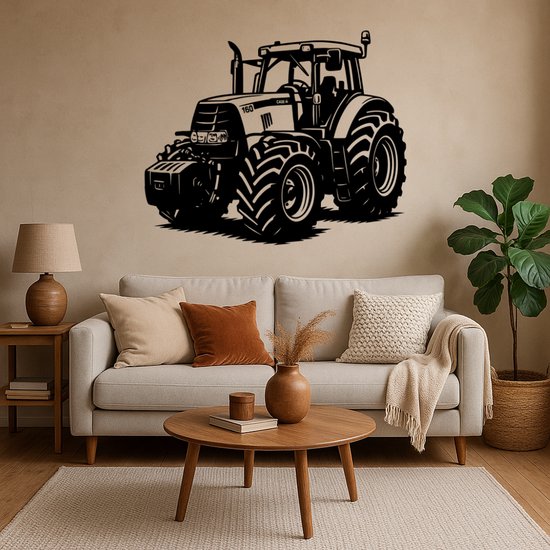 Zwarte tractor muursticker boven een bank met bruine en crèmekleurige kussens.
