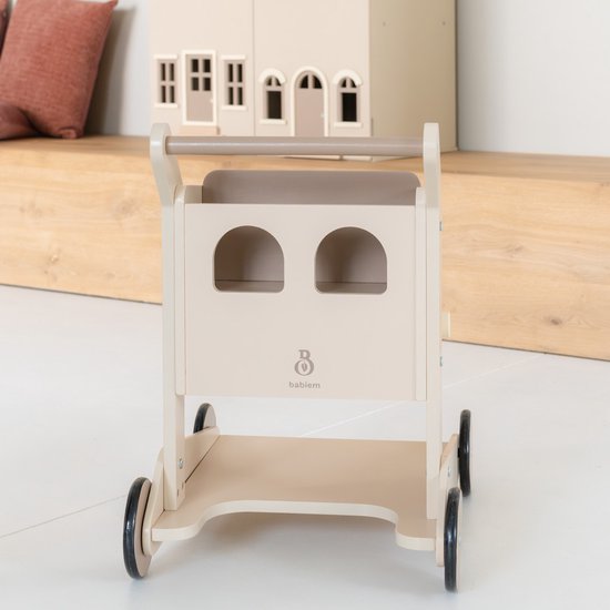 Houten loopwagen in zandkleur met twee ronde uitsparingen en het 'babi-em' logo op de voorkant.