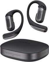 Zwarte Shokz OpenFit Pro oordopjes en oplaadstation, zwevend.