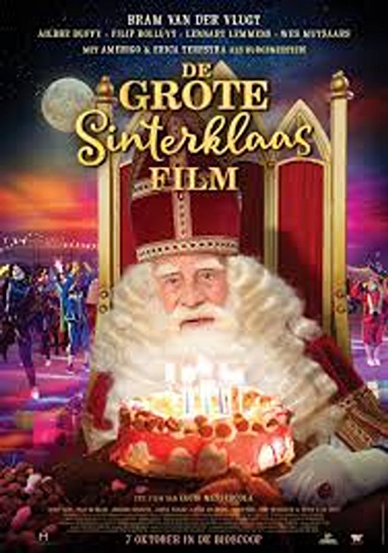 Sinterklaas met baard en mijter zit in een troon met een taart met brandende kaarsen. Titel: De Grote Sinterklaas Film.