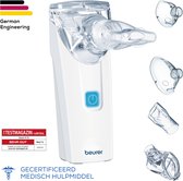 Witte beurer inhalator met vier bijbehorende maskers, op de voorgrond.