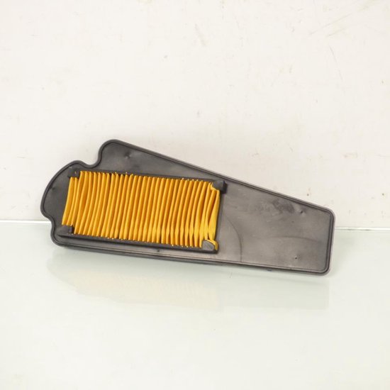 Filtre à air de moto noir avec média filtrant plissé jaune.