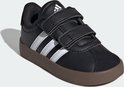 Zwarte Adidas sneaker met witte strepen en klittenbandsluiting, bruine zool.