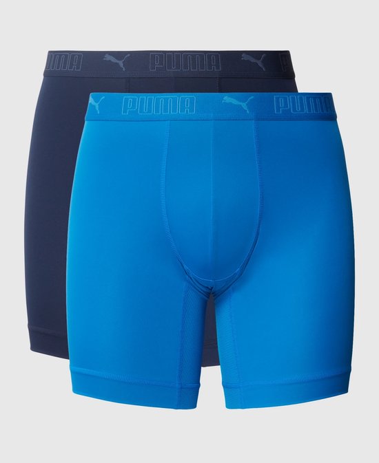 Twee Puma boxershorts: één helderblauwe en één marineblauwe, met logo-elastische band.