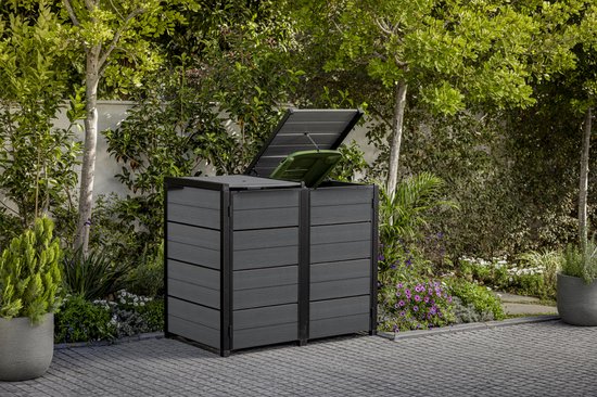 Double abri à poubelles anthracite avec couvercles ouverts dans un jardin.