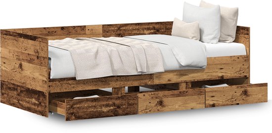 Bedbank in verweerd hout met opgemaakt bed, kussens en open lades aan de voorkant.