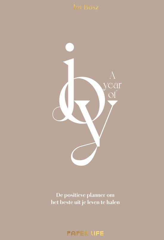 De voorkant van de planner toont de tekst 'Joy' in grote, sierlijke witte letters op een taupe achtergrond. Daaronder staat 'A year of Joy' en 'De positieve planner om het beste uit je leven te halen'.