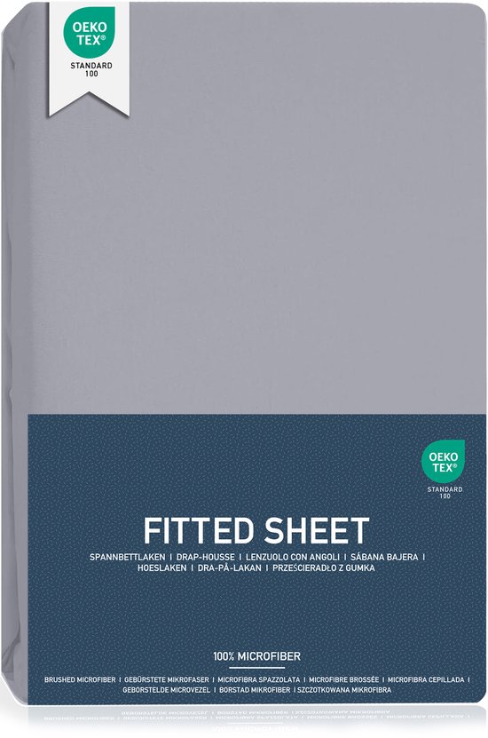 Drap plat gris plié avec "FITTED SHEET" et "100% MICROFIBER" en français.