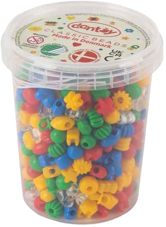Een doorzichtige plastic pot gevuld met diverse kleuren en vormen Dantoy Tivoli XL kralen, waaronder bloemen, sterren en ronde vormen in rood, geel, blauw en groen.