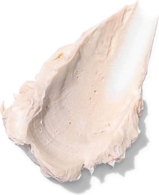 Texture de pommade crémeuse rose clair, sur fond blanc.