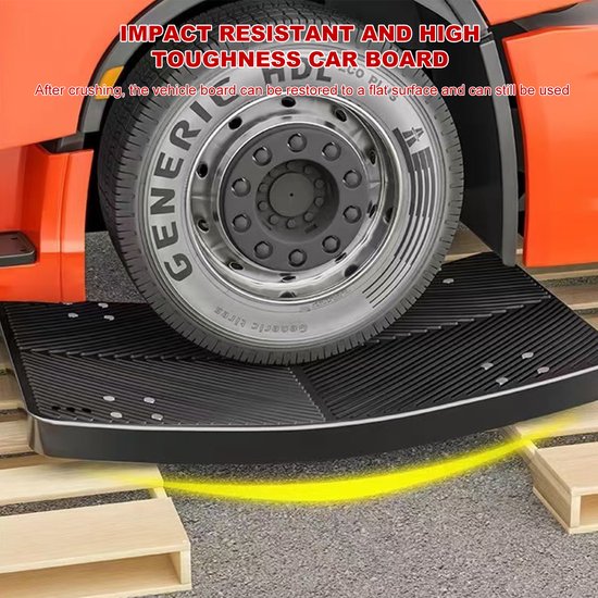 Zwarte, slagvaste plateauwagen onder het wiel van een vrachtwagen.