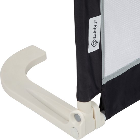 Detail van beige steun en label met logo op donkergrijs bedhek.