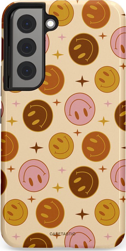 Telefoonhoesje met een achtergrond van beige met een retro patroon van smiley gezichten en sterren in bruin en roze.