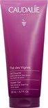 Paarse Caudalie douchegel tube van 200 ml, met tekst. Staat op een witte achtergrond.