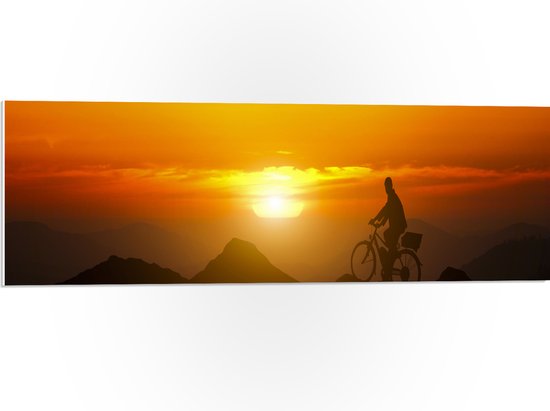 PVC Schuimplaat- Silhouet van Man Fietsend over Kronkelende Bergtoppen bij Felkleurige Zonsondergang - 90x30 cm Foto op PVC Schuimplaat