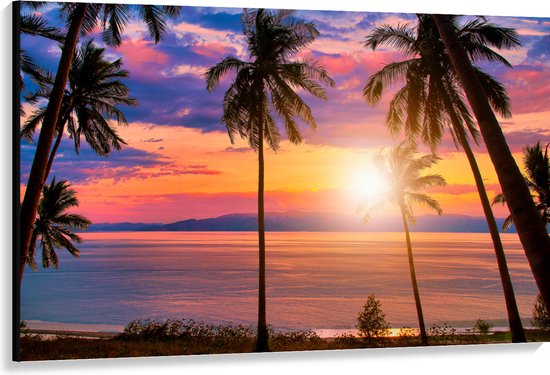 Canvas - Zonsondergang in de Zee bij Hoge Palmbomen - 150x100 cm Foto op Canvas Schilderij (Wanddecoratie op Canvas)