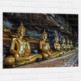 Muursticker - Rijen Gouden Boeddha's in Wat Tham Khuha Sawan Tempel in Thailand - 100x75 cm Foto op Muursticker