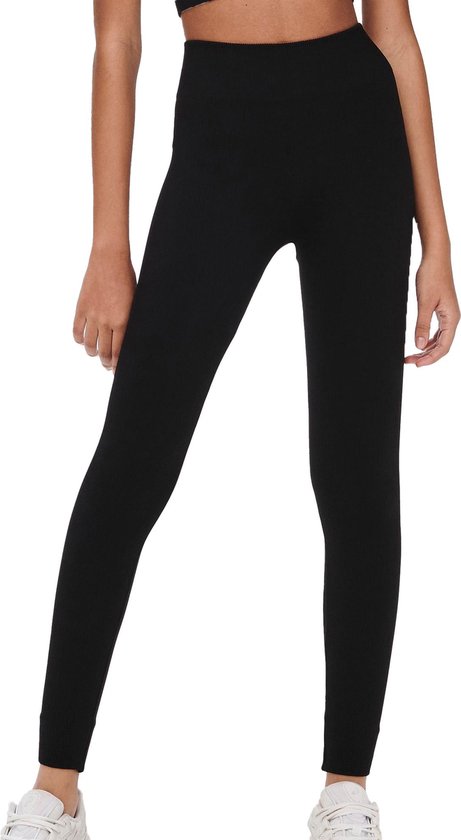 Zwarte, nauwsluitende sportlegging met hoge taille en geribd patroon, gedragen door een model.