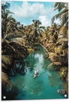 Tuinposter – Persoon - Bootje - Water - Blauw - Bomen - Palmbomen - Groen - Tropisch - 60x90 cm Foto op Tuinposter (wanddecoratie voor buiten en binnen)