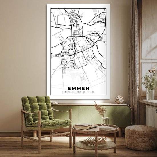 Affiche carte d'Emmen en noir et blanc, accroché au-dessus d'une commode verte.